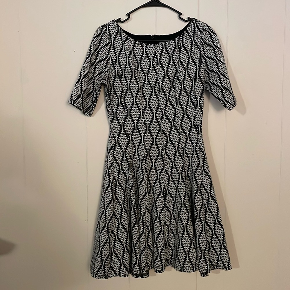 Danny and Nicole black and white mid length dress.